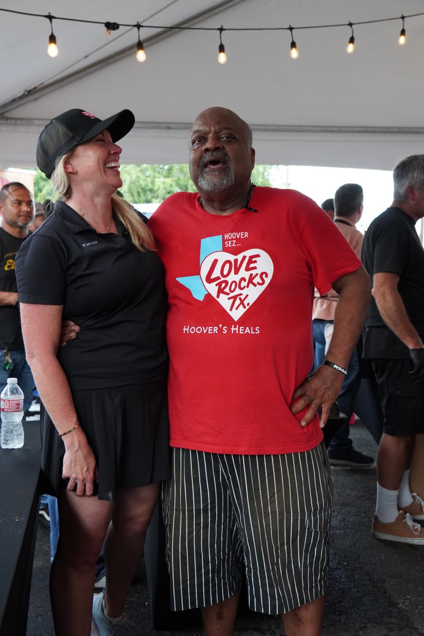 Hoover Alexander sharing a laugh with a guest at a community event